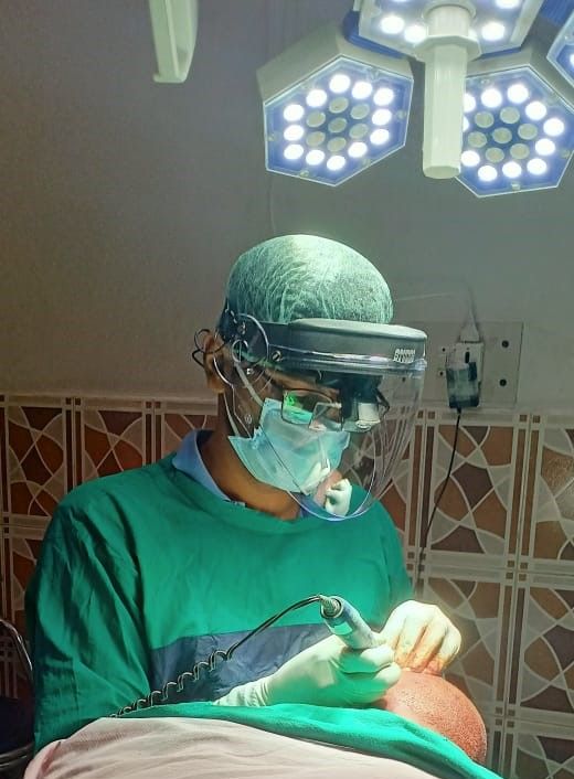 Dr Navdeep goyal doing hair transplant